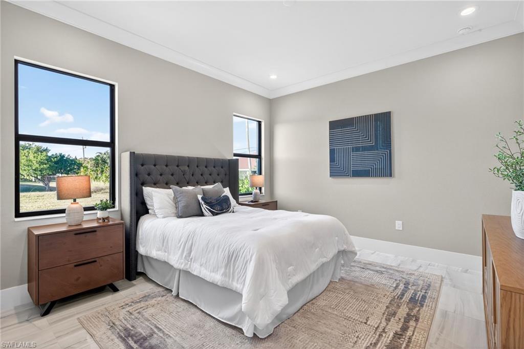 Bedroom featuring crown molding and recessed lighting