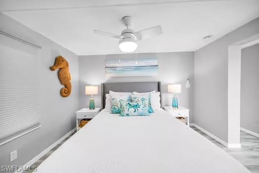Bedroom featuring baseboards and ceiling fan