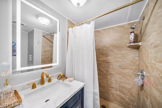 Bathroom featuring vanity and a stall shower