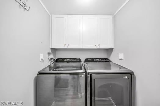 Laundry area with cabinet space and separate washer and dryer