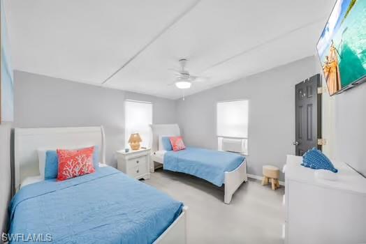 Bedroom featuring ceiling fan and carpet flooring