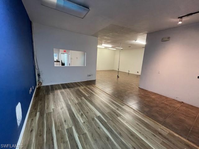 Basement with dark wood-style floors