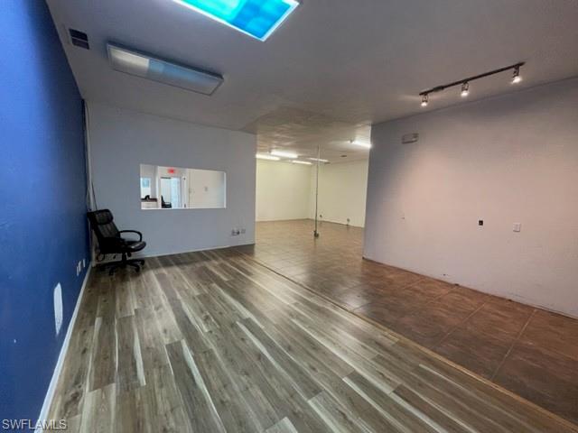 Unfurnished room with wood finished floors