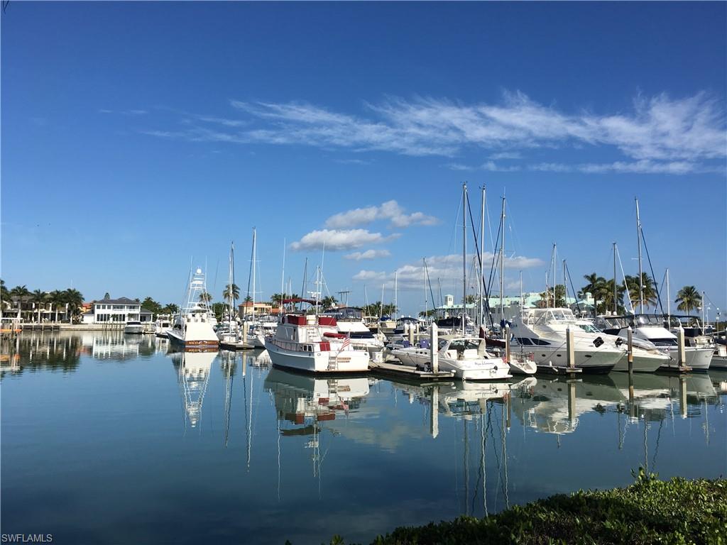 Dock with a water view and view of marina