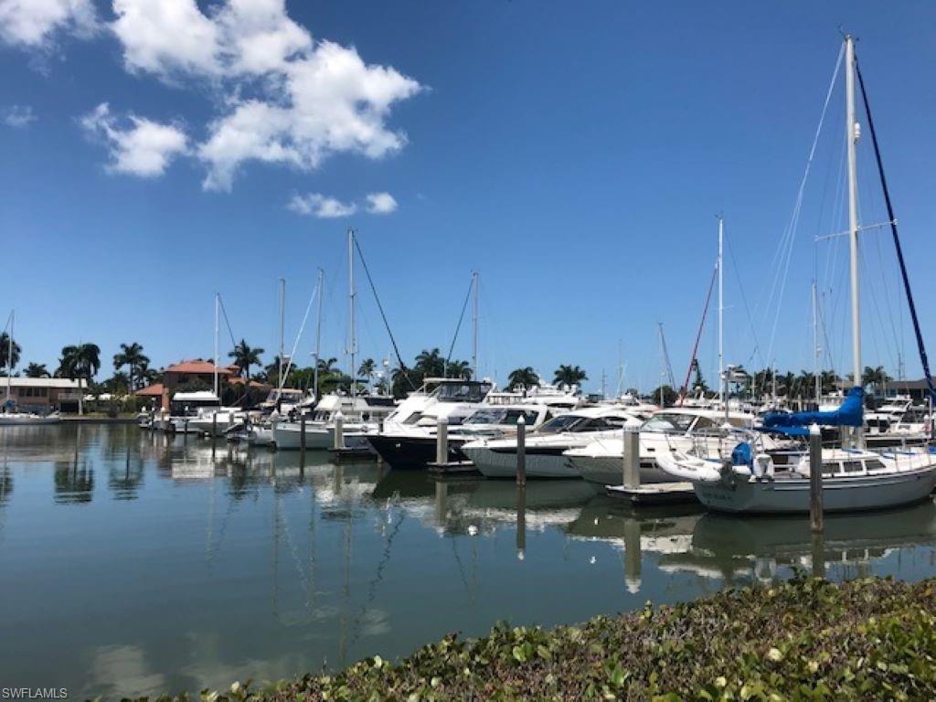 Dock featuring a water view and view of marina