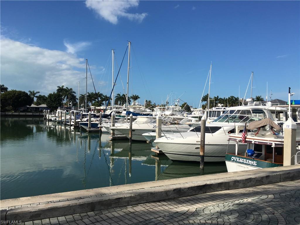 Dock with a water view and view of marina