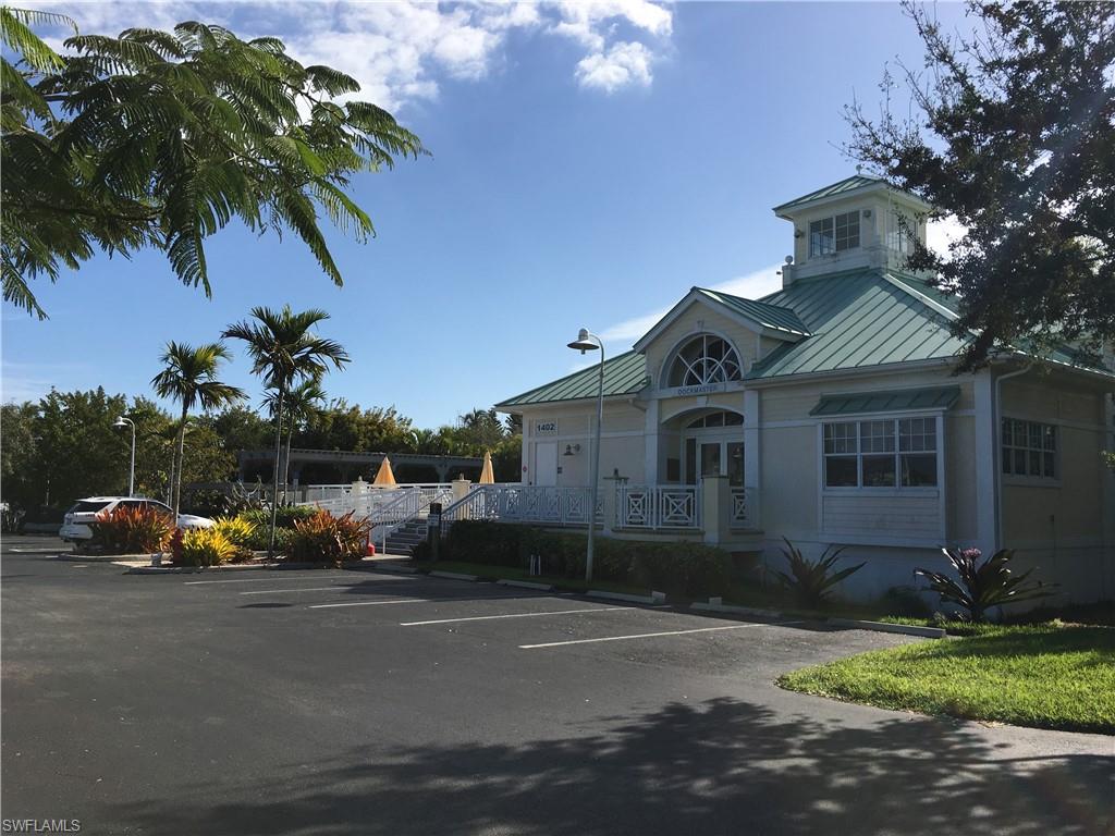 View of property with uncovered parking