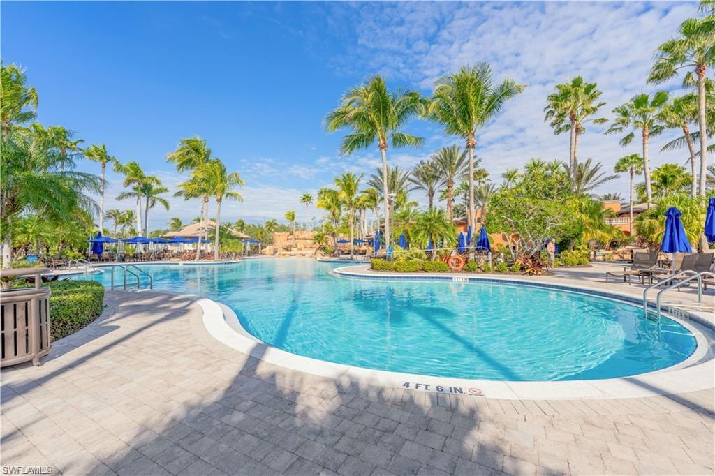Community pool with a patio