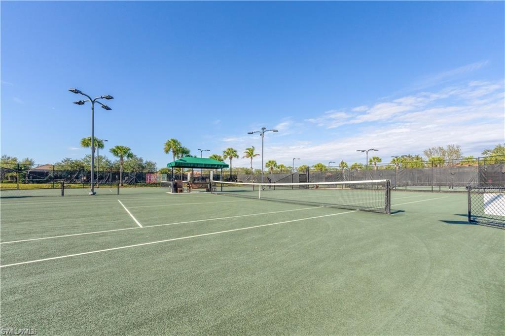 View of tennis court with a gazebo