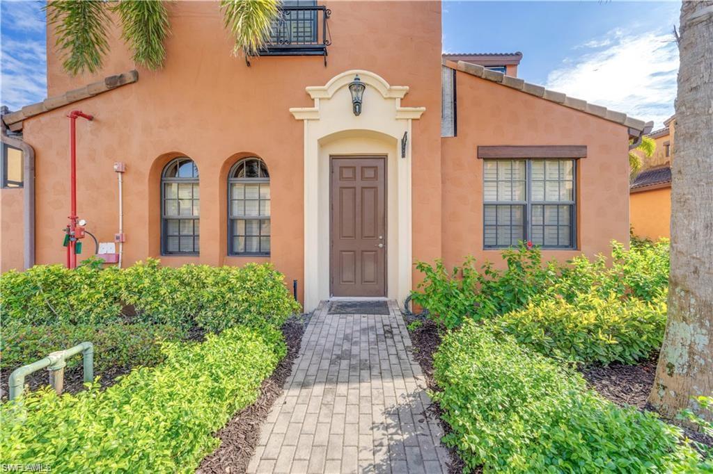 Property entrance featuring stucco siding