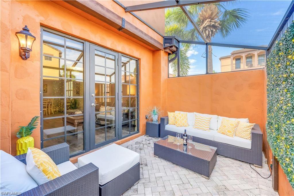View of patio featuring french doors, an outdoor hangout area, a sunroom, and a lanai