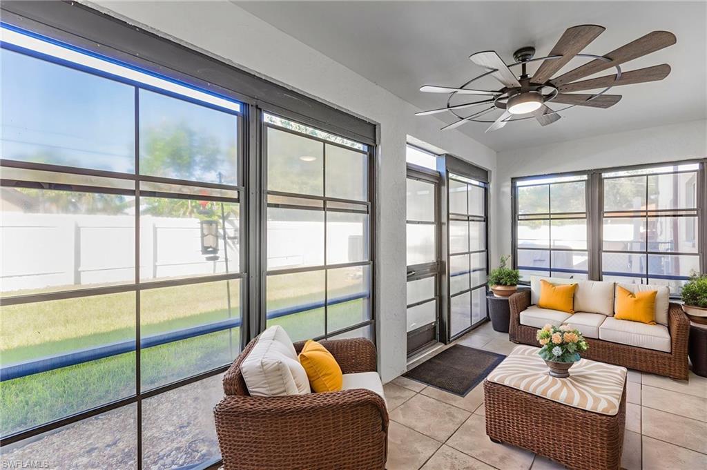 Sunroom / solarium with tile patterned flooring