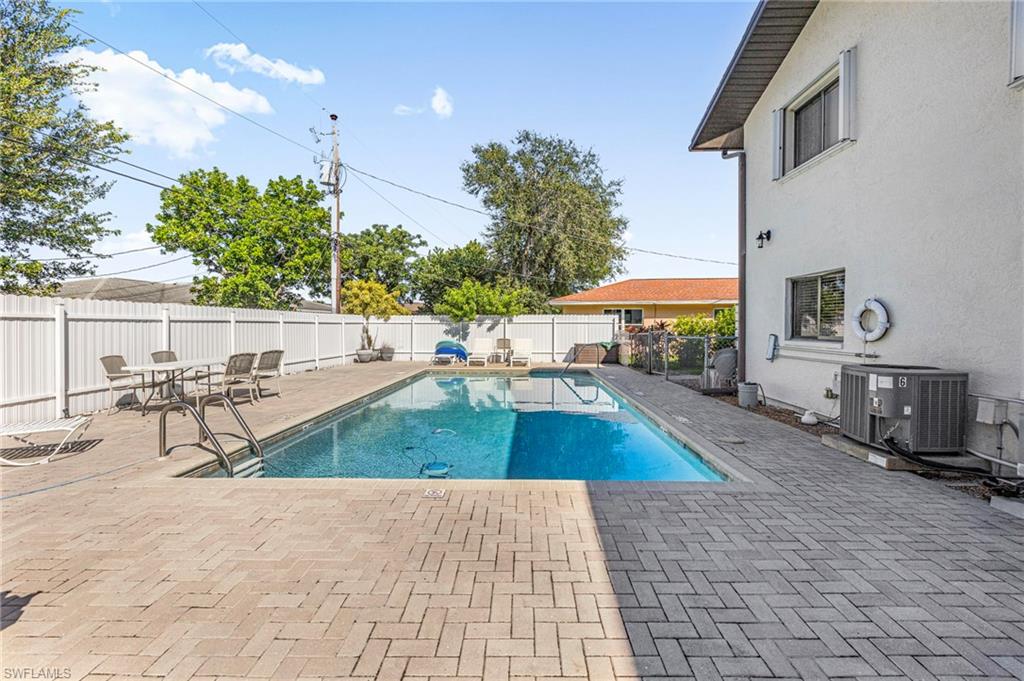 View of swimming pool featuring a patio and a fenced backyard