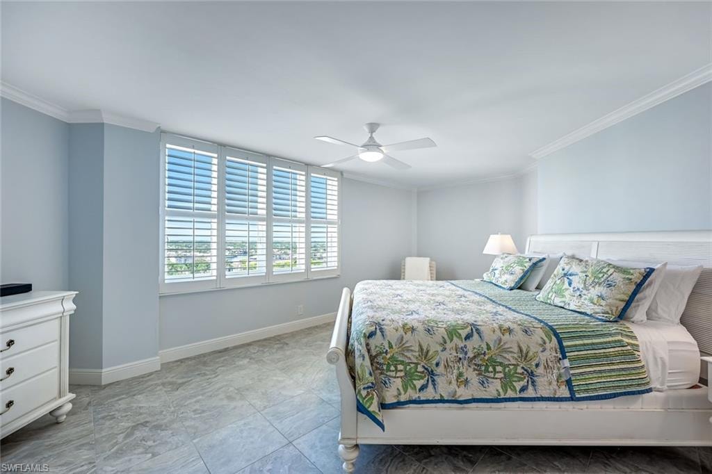 Bedroom featuring ornamental molding and ceiling fan