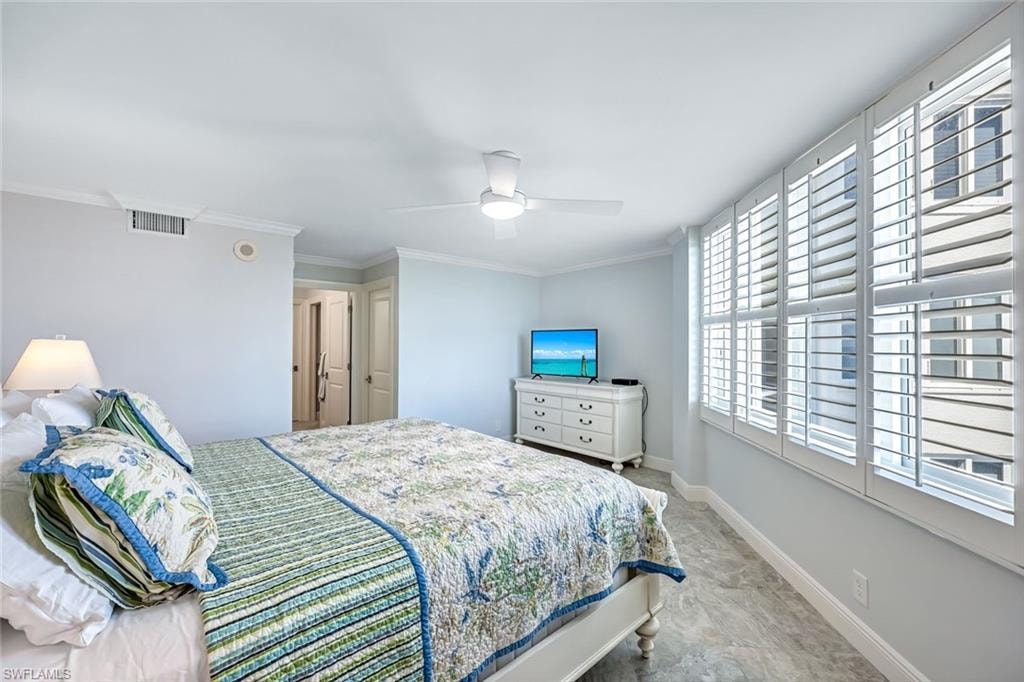 Bedroom featuring ornamental molding and a ceiling fan