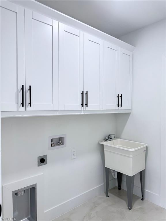 Laundry area featuring cabinet space, washer hookup, and electric dryer hookup