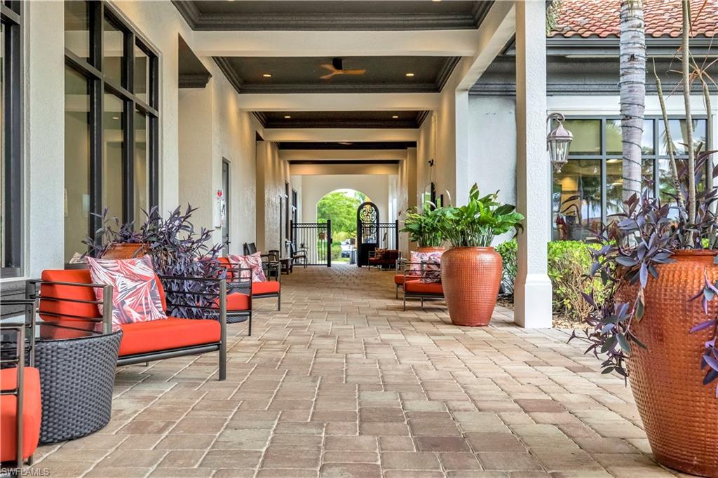 Community lobby featuring ornamental molding and beamed ceiling
