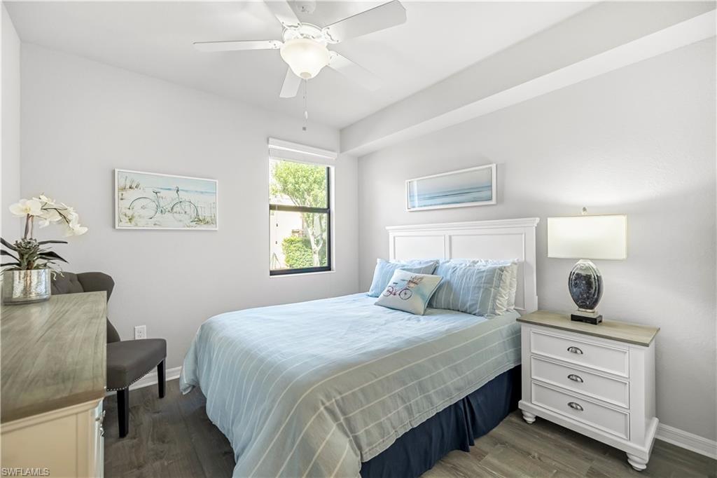 Bedroom featuring dark wood-type flooring and a ceiling fan