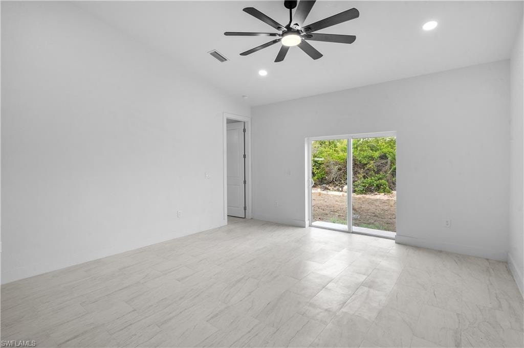 Empty room featuring recessed lighting and a ceiling fan