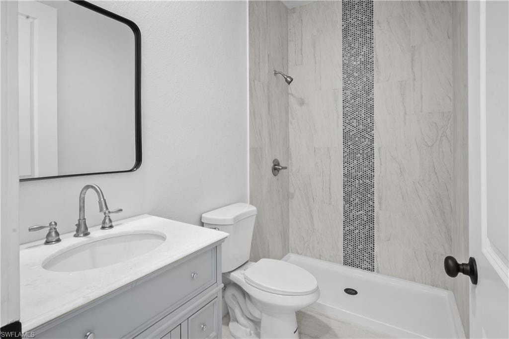 Bathroom with vanity and a stall shower