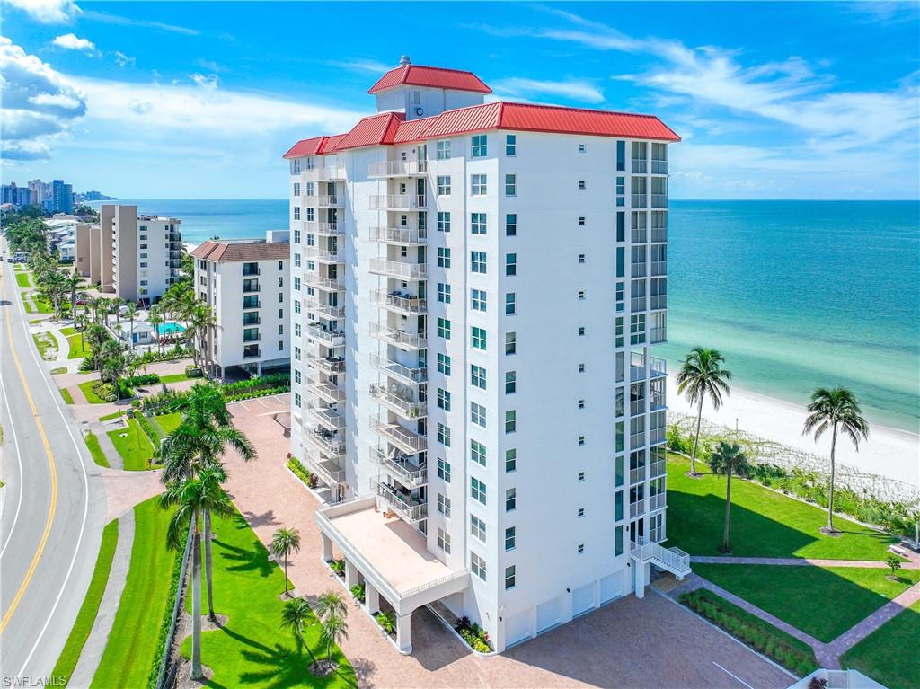 View of apartment building / complex featuring a water view