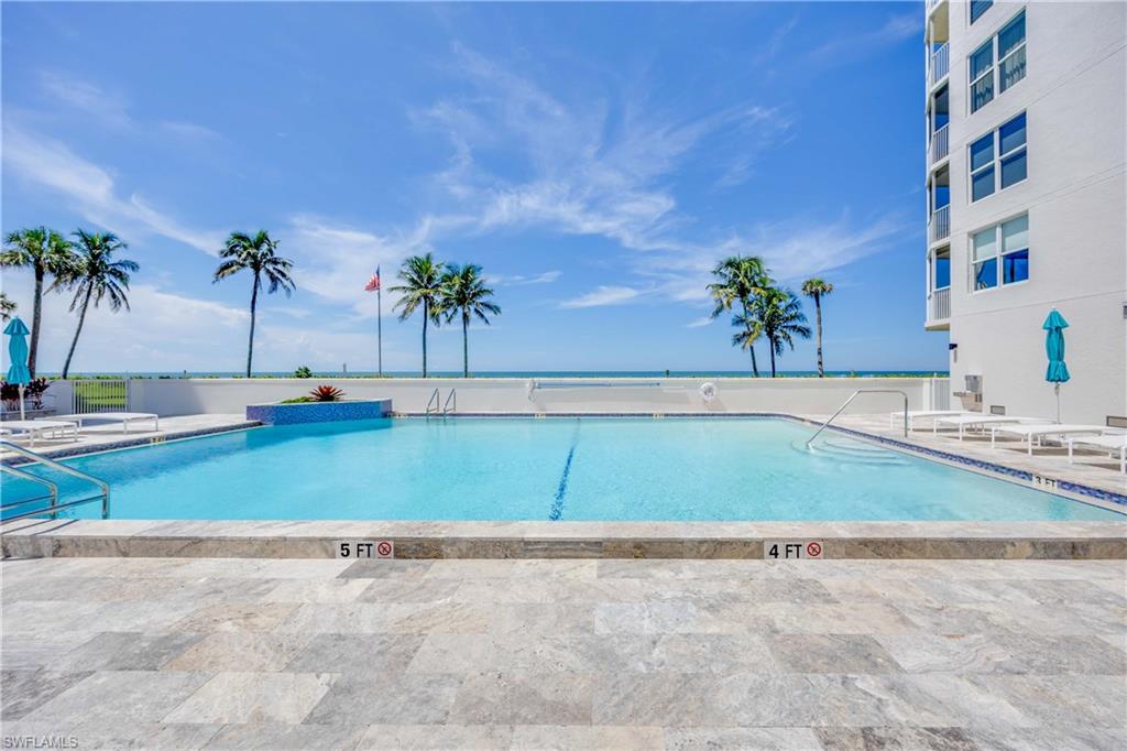 Community pool featuring a patio