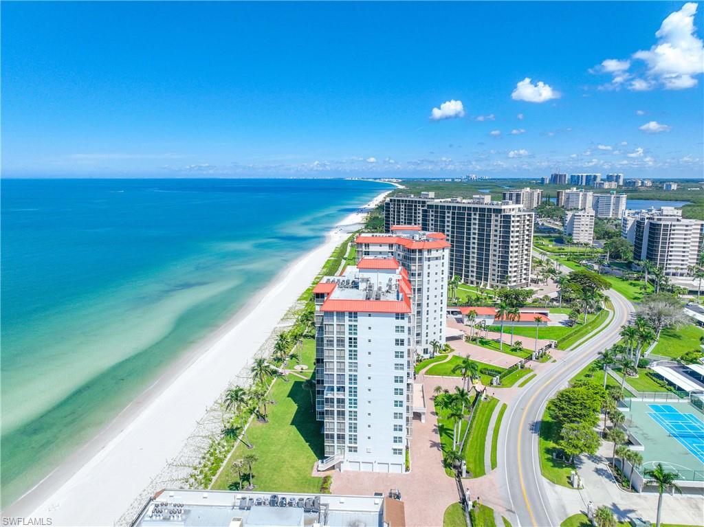 Bird's eye view of apartment complex and unending shoreline