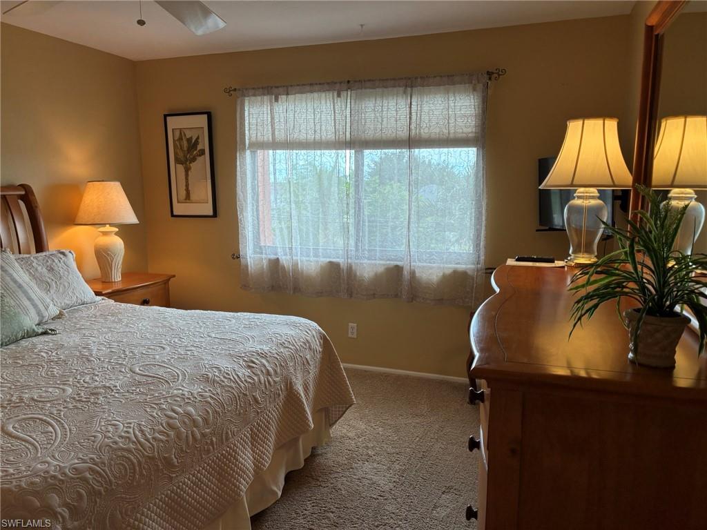 Bedroom featuring carpet floors and ceiling fan