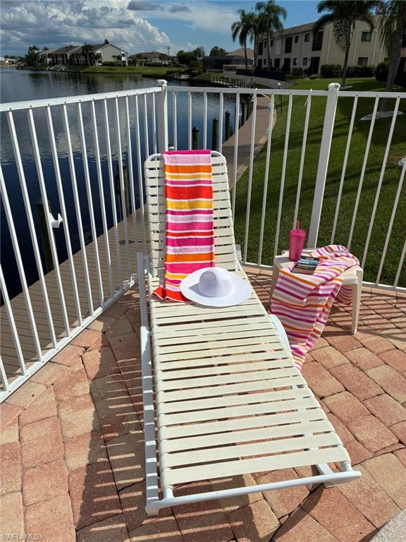 Balcony with a water view and a residential view