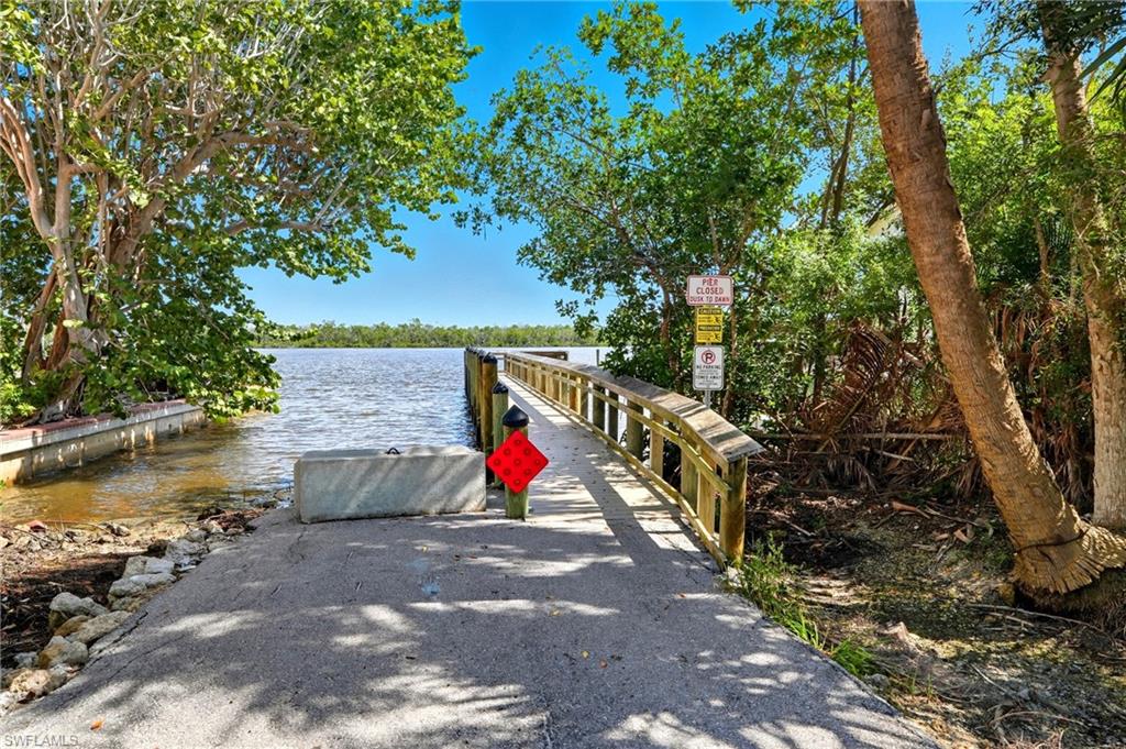 Dock featuring a boat entrance, fishing pier and a water view - Virtually Edited Image
