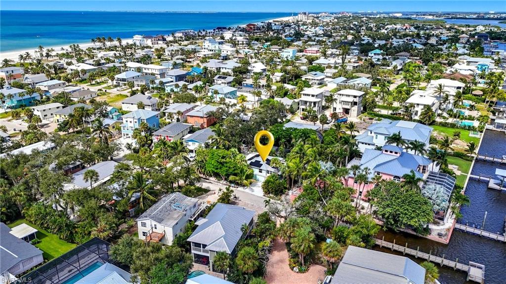 Aerial perspective of suburban area with a nearby body of water - Virtually Edited Image