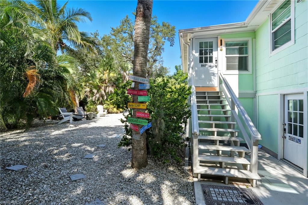 View of yard and entrance to the property - Virtually Edited Image