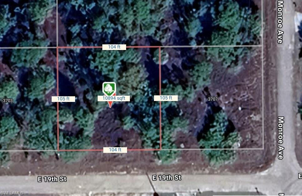 Aerial overview of property's location featuring property parcel outlined