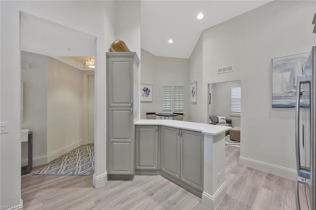 Bathroom featuring light wood-type flooring and recessed lighting