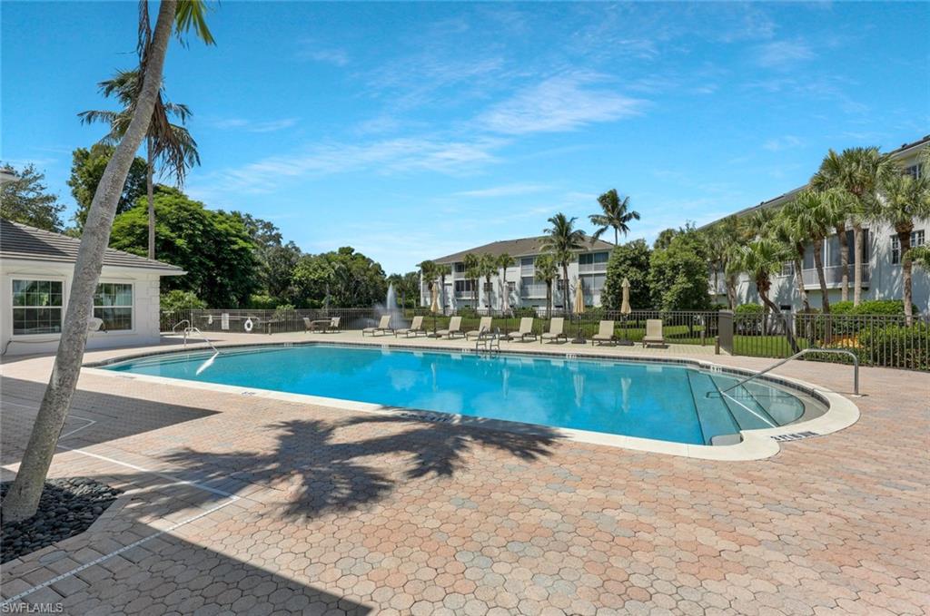 Community pool featuring a patio area
