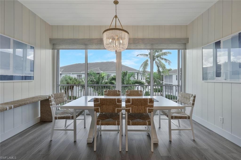 Sunroom / solarium with a chandelier