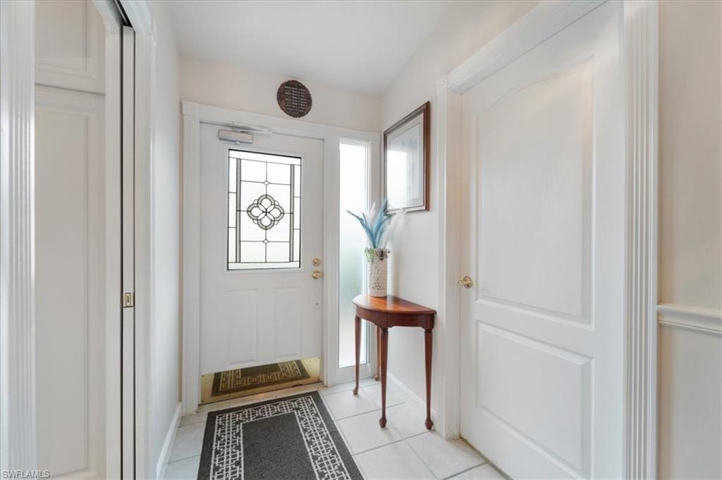 Doorway with tile patterned flooring