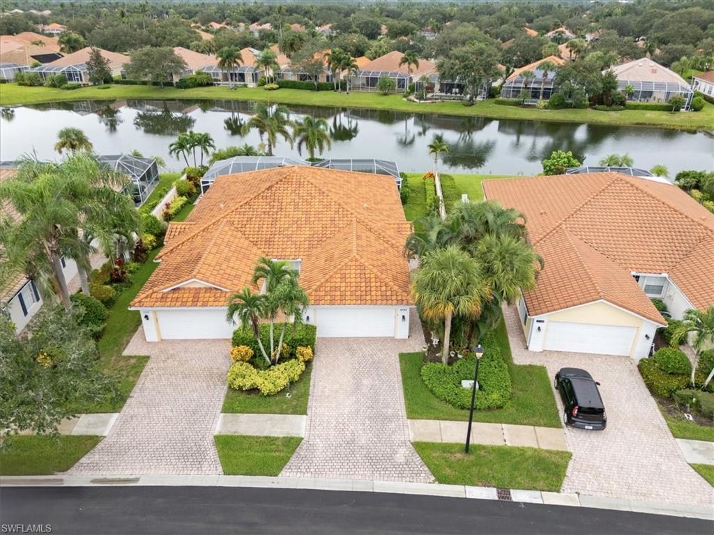 Aerial perspective of suburban area with a large body of water
