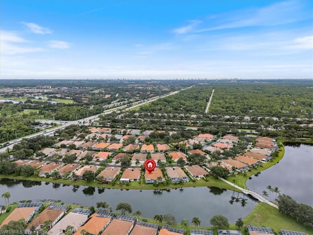 Aerial overview of property's location with a nearby body of water and nearby suburban area