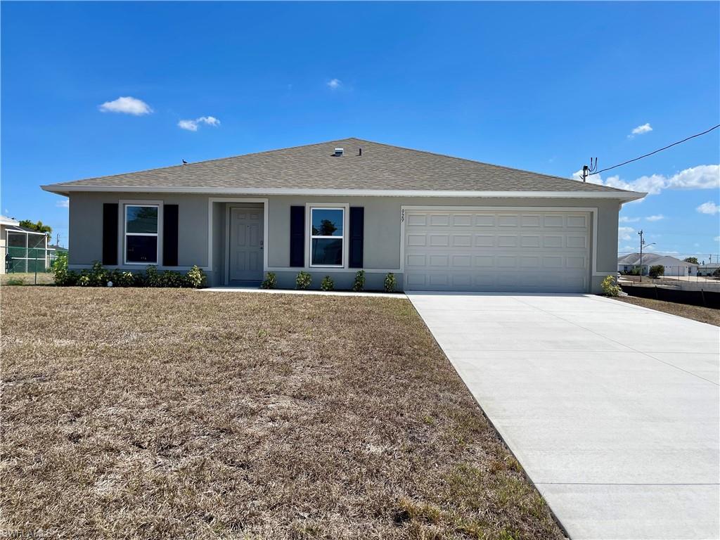 Ranch-style home featuring stucco siding, concrete driveway, roof with shingles, and an attached garage