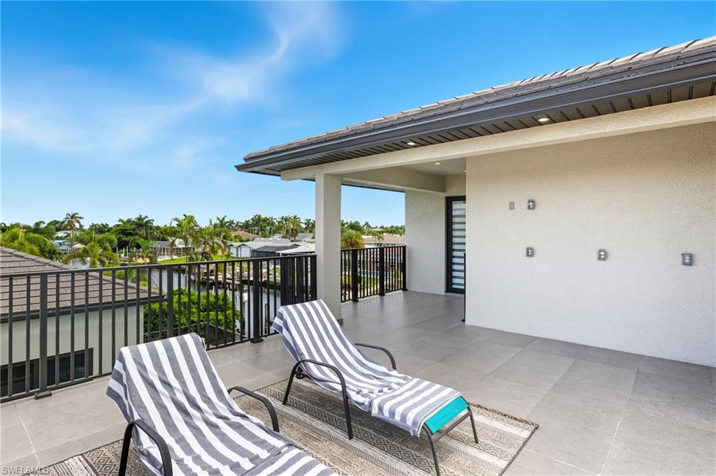 View of patio / terrace featuring a residential view and a water view