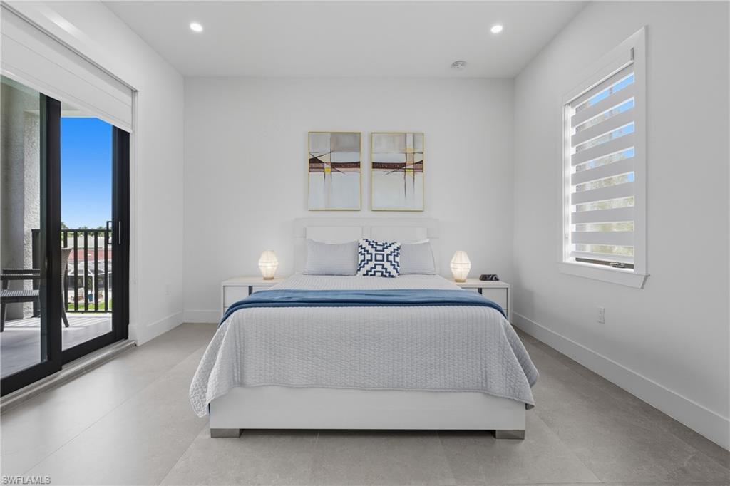 Bedroom with access to exterior and recessed lighting