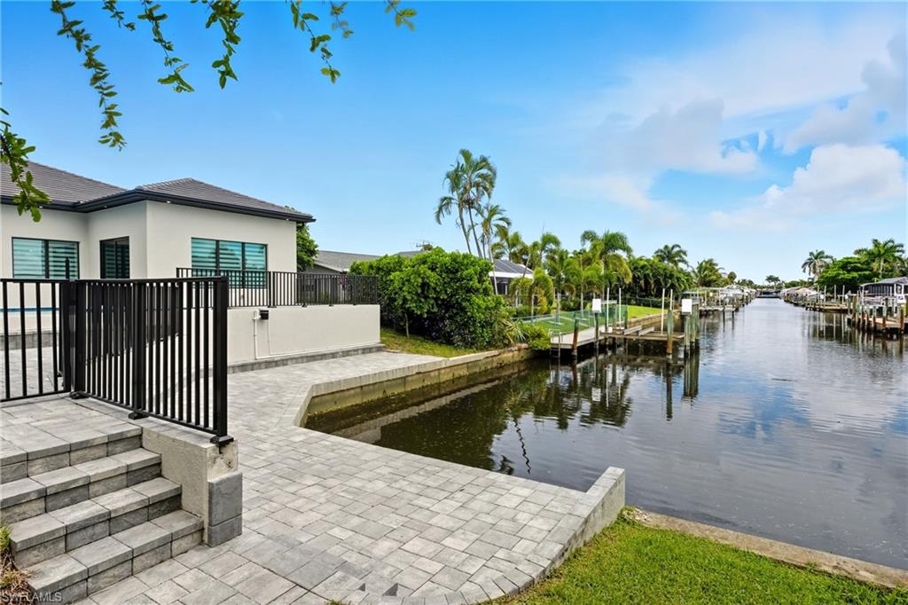 Room for future dock with a water view and a patio