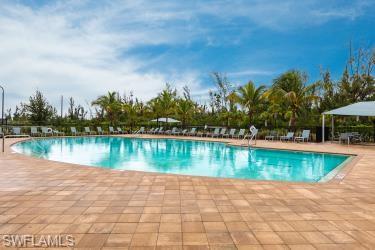 Community pool with a patio area