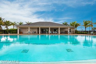 Community pool featuring a patio