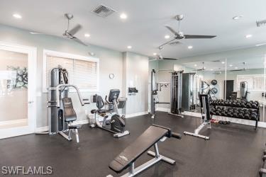 Gym featuring recessed lighting and ceiling fan