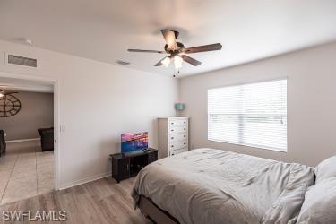 Bedroom featuring light wood finished floors and a ceiling fan