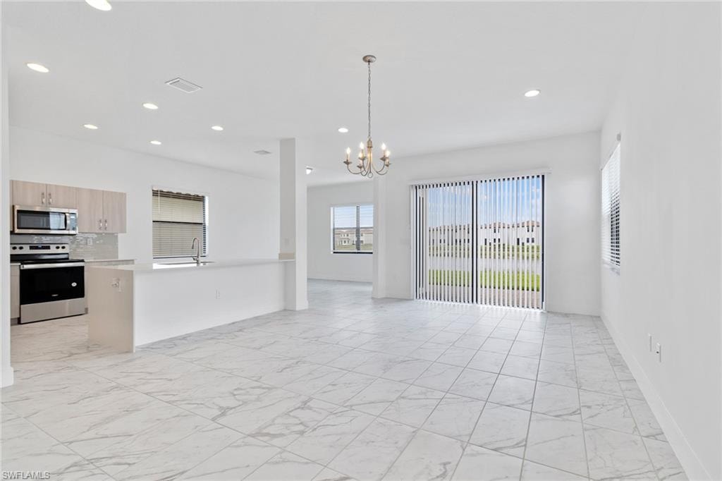 Living room featuring tile  flooring, and recessed lighting.
