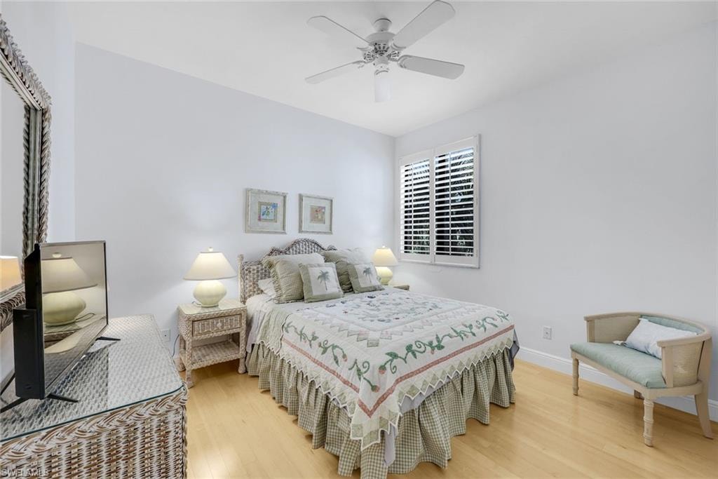 Bedroom with light wood-style flooring and ceiling fan
