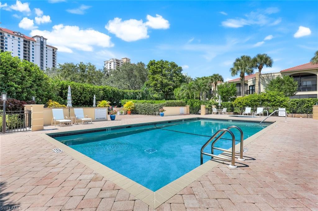Community pool featuring a patio